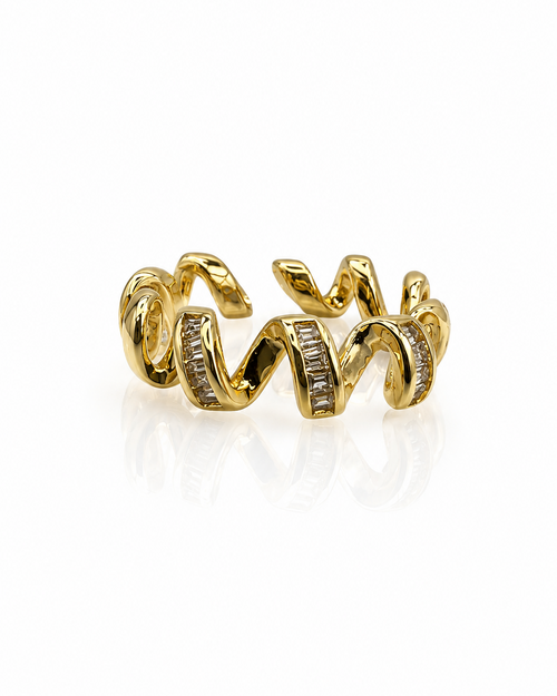 Bague Onda dorée ruban sinueux zircons taille baguette